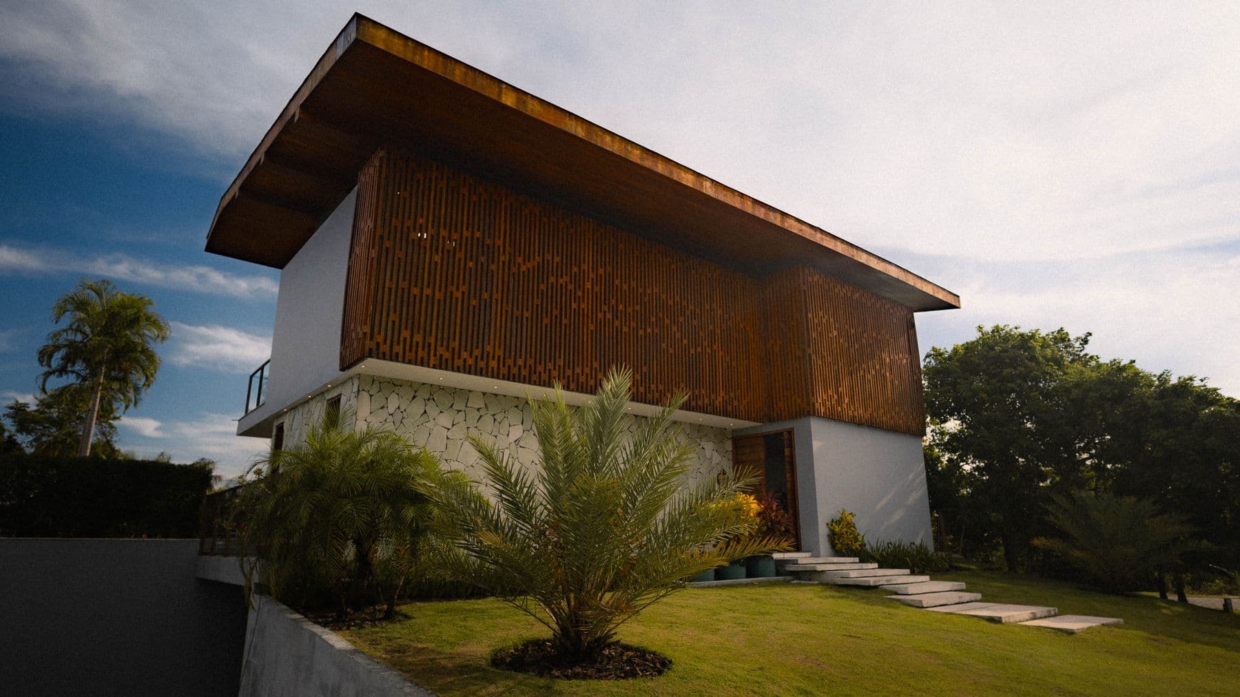 Casa Kawayan: visualization of a modern tropical house with warm wood screens